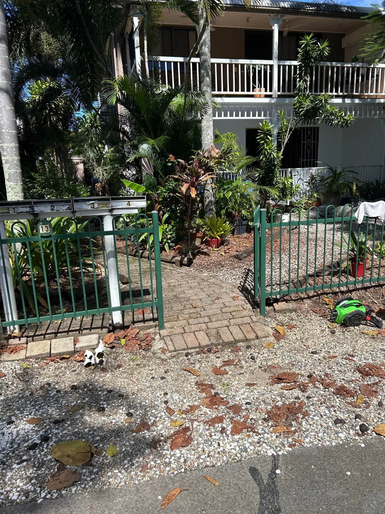 Old metal front fence and gate before replacement