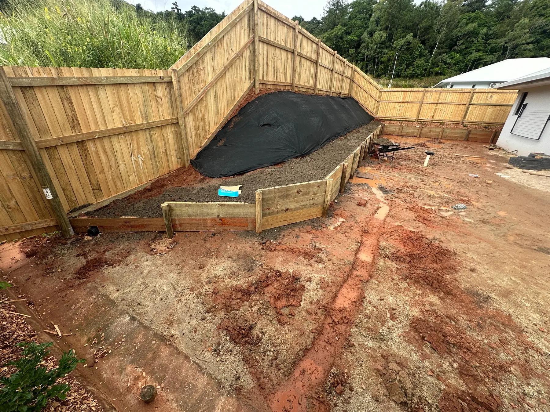 Timber retaining wall and garden terrace under construction