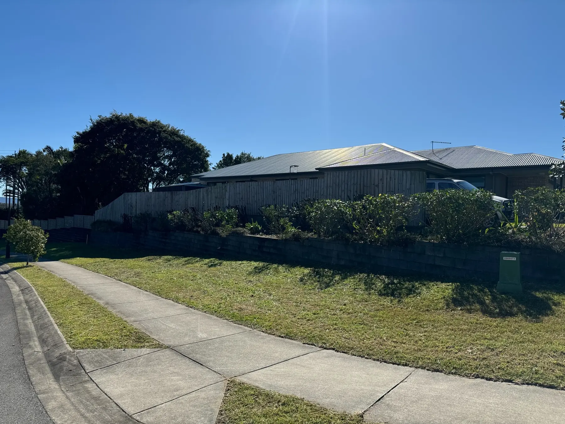Corner property with verge mown and gardens cut back after clean-up